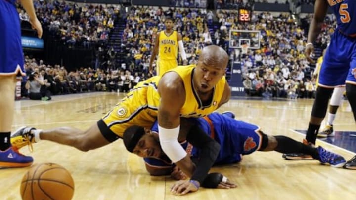 Jan 16, 2014; Indianapolis, IN, USA; New York Knicks forward Carmelo Anthony (7) scrambles for a loose ball against Indiana Pacers forward David West (21) at Bankers Life Fieldhouse. Indiana defeats New York 117- 89. Mandatory Credit: Brian Spurlock-USA TODAY Sports