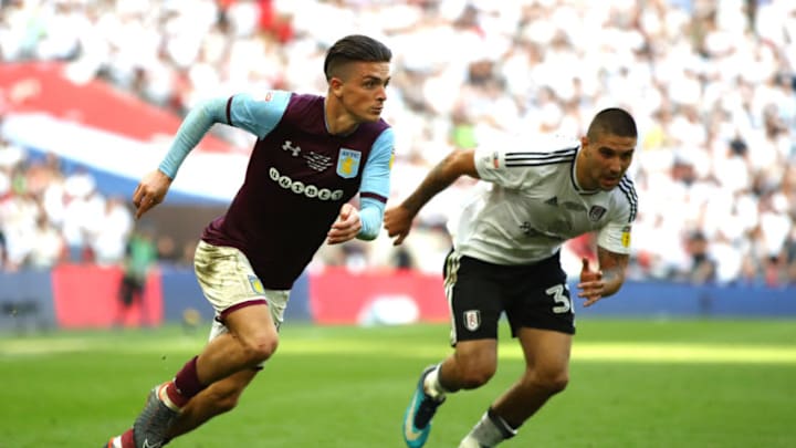 LONDON, ENGLAND - MAY 26: Jack Grealish of Aston Villa runs with the ball under pressure from Aleksandar Mitrovic of Fulham during the Sky Bet Championship Play Off Final between Aston Villa and Fulham at Wembley Stadium on May 26, 2018 in London, England. (Photo by Clive Mason/Getty Images)