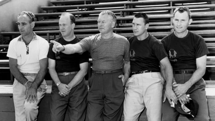 Washington Redskins coaching staff (L-R) Wayne Millner, Herman Ball, Head coach Curly Lambeau, and Hall of Fame back Bill Dudley. (Photo by Nate Fine/Getty Images)