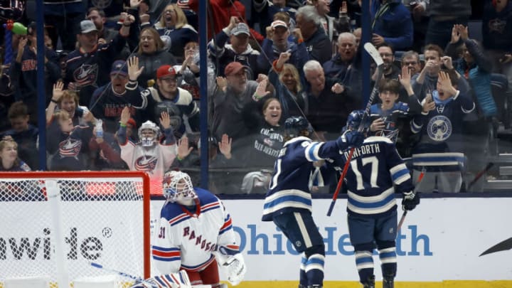 COLUMBUS, OHIO - OCTOBER 14: Justin Danforth #17 of the Columbus Blue Jackets is congratulated by Kent Johnson #91 after beating Igor Shesterkin #31 of the New York Rangers for a goal during the third period of the game at Nationwide Arena on October 14, 2023 in Columbus, Ohio. Columbus defeated New York 5-3. (Photo by Kirk Irwin/Getty Images)