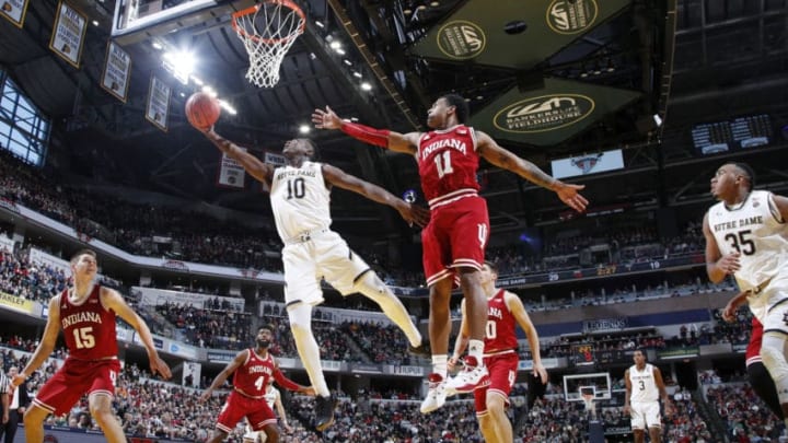 INDIANAPOLIS, IN - DECEMBER 16: TJ Gibbs #10 of the Notre Dame Fighting Irish drives to the basket against Devonte Green #11 of the Indiana Hoosiers in the first half of the Crossroads Classic at Bankers Life Fieldhouse on December 16, 2017 in Indianapolis, Indiana. (Photo by Joe Robbins/Getty Images)