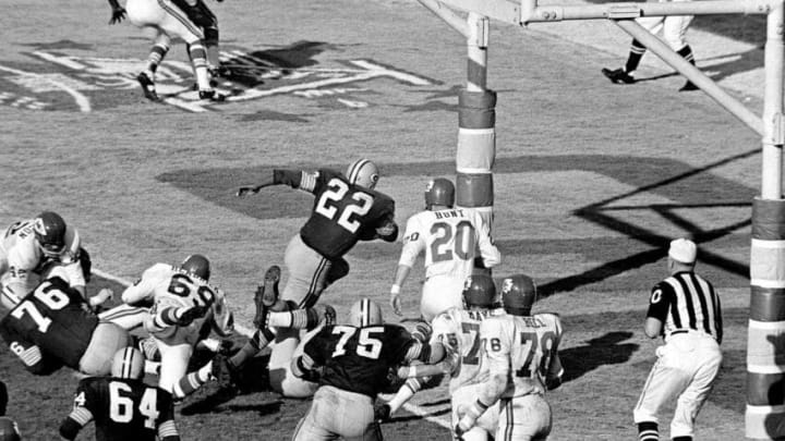 Green Bay's Elijah Pitts (22) charges into the end zone, eluding Bobby Hunt (20), during the first Super Bowl in Los Angeles, Jan. 16, 1967. Pitts scored from the five on the play following Willie Wood's interception in the third quarter. Packers beat the Chiefs, 35-10.Elijah Pitts Bobby Hunt