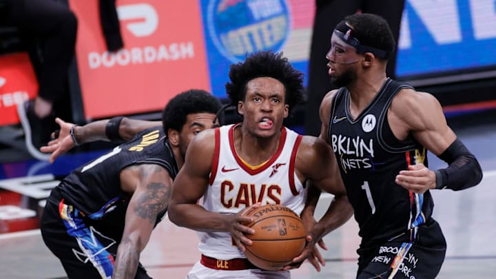 NEW YORK, NEW YORK – MAY 16: Collin Sexton #2 of the Cleveland Cavaliers drives to the basket Kyrie Irving #11 and Bruce Brown #1 of the Brooklyn Nets defend during the second half against the Brooklyn Nets at Barclays Center on May 16, 2021 in the Brooklyn borough of New York City. NOTE TO USER: User expressly acknowledges and agrees that, by downloading and or using this photograph, User is consenting to the terms and conditions of the Getty Images License Agreement. (Photo by Sarah Stier/Getty Images)