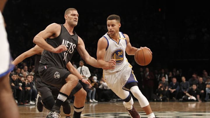 Dec 22, 2016; Brooklyn, NY, USA; Golden State Warriors guard Stephen Curry (30) drives to the basket against Brooklyn Nets center Brook Lopez (11) during the first quarter against the Golden State Warriors at Barclays Center. Mandatory Credit: Nicole Sweet-USA TODAY Sports0