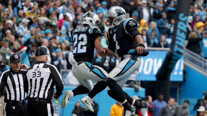 CHARLOTTE, NC – DECEMBER 17: Christian McCaffrey #22 celebrates with teammate Cam Newton #1 of the Carolina Panthers after a touchdown against the Green Bay Packers in the first quarter during their game at Bank of America Stadium on December 17, 2017 in Charlotte, North Carolina. (Photo by Streeter Lecka/Getty Images)