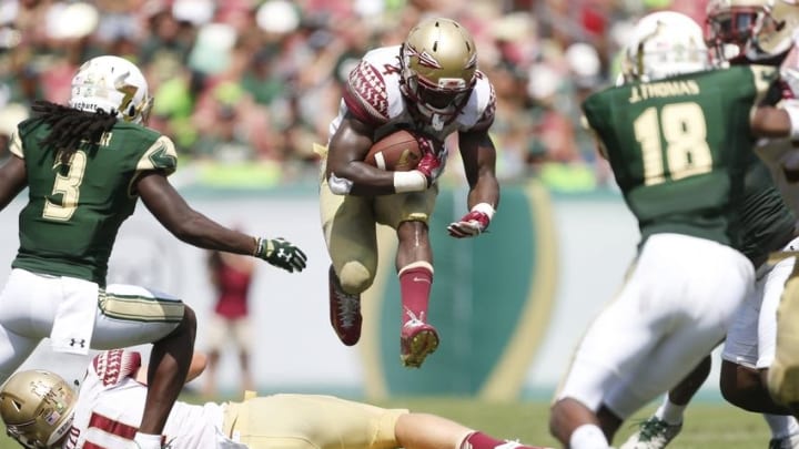 Sep 24, 2016; Tampa, FL, USA; Florida State Seminoles running back Dalvin Cook (4) runs the ball in the second half against the South Florida Bulls at Raymond James Stadium. Florida State Seminoles won 55-35. Mandatory Credit: Logan Bowles-USA TODAY Sports
