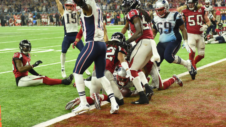 TOPSHOT – James White #28 of the New England Patriots scores the game winning touchdown in overtime against the Atlanta Falcons during Super Bowl 51 at NRG Stadium on February 5, 2017 in Houston, Texas (Photo by Timothy A. CLARY / AFP) (Photo credit should read TIMOTHY A. CLARY/AFP via Getty Images)