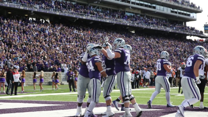 MANHATTAN, KS - OCTOBER 13: A wide view as Kansas State Wildcats running back Alex Barnes (34) is congratulated by teammates after his touchdown run in the third quarter of a Big 12 football game between the Oklahoma State Cowboys and Kansas State Wildcats on October 13, 2018 at Bill Snyder Family Stadium in Manhattan, KS. Kansas State won 31-12. (Photo by Scott Winters/Icon Sportswire via Getty Images)