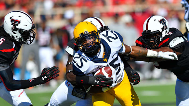 LUBBOCK, TX - OCTOBER 15: Justin Crawford #25 of the West Virginia Mountaineers runs the ball against the Texas Tech Red Raiders during the game on October 15, 2016 at AT&T Jones Stadium in Lubbock, Texas. (Photo by John Weast/Getty Images)
