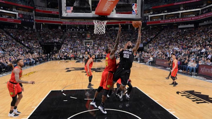 SACRAMENTO, CA - JANUARY 30: Willie Cauley-Stein #00 of the Sacramento Kings puts up a shot against Dewayne Dedmon #14 of the Atlanta Hawks on January 30, 2019 at Golden 1 Center in Sacramento, California. NOTE TO USER: User expressly acknowledges and agrees that, by downloading and or using this photograph, User is consenting to the terms and conditions of the Getty Images Agreement. Mandatory Copyright Notice: Copyright 2019 NBAE (Photo by Rocky Widner/NBAE via Getty Images)