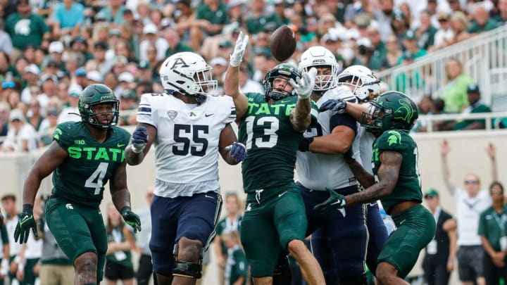 Michigan State linebacker Ben VanSumeren tries to grab the loose ball against Akron offensive lineman Anthony Whigan (55) during the first half at Spartan Stadium in East Lansing on Saturday, Sept. 10, 2022.