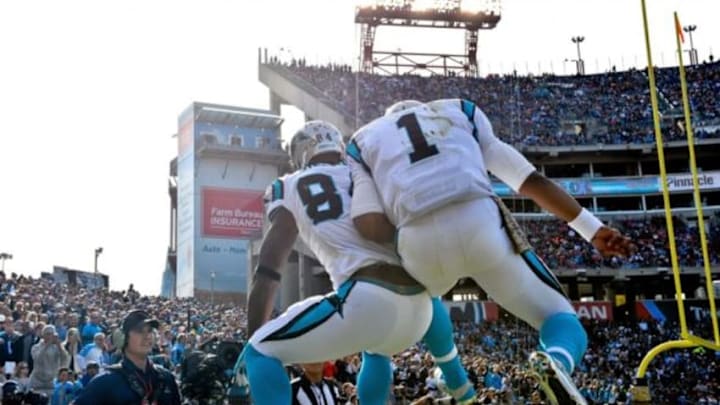 Nov 15, 2015; Nashville, TN, USA; Carolina Panthers tight end Ed Dickson (84) catches a pass for a touchdown and celebrates with Carolina Panthers quarterback Cam Newton (1) during the first half against the Tennessee Titans at Nissan Stadium. Mandatory Credit: Jim Brown-USA TODAY Sports