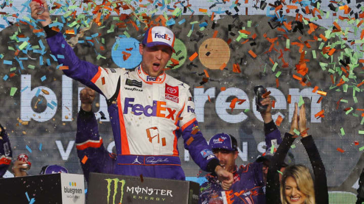 AVONDALE, ARIZONA - NOVEMBER 10: Denny Hamlin, driver of the #11 FedEx Ground Toyota, celebrates in Victory Lane after winning the Monster Energy NASCAR Cup Series Bluegreen Vacations 500 at ISM Raceway on November 10, 2019 in Avondale, Arizona. (Photo by Jonathan Ferrey/Getty Images)