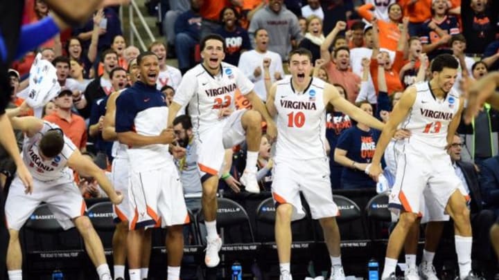 Mar 23, 2014; Raleigh, NC, USA; The Virginia Cavaliers bench reacts to a play against the Memphis Tigers during the second half of a men’s college basketball game during the third round of the 2014 NCAA Tournament at PNC Arena. Mandatory Credit: Bob Donnan-USA TODAY Sports