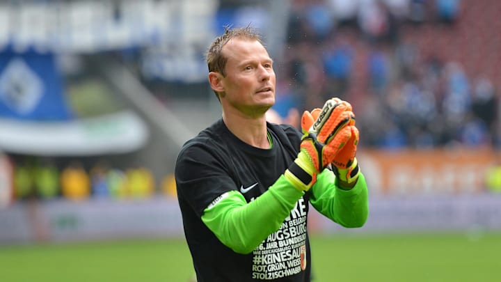 AUGSBURG, GERMANY - MAY 14: Alexander Manninger, goalkeeper of Augsburg celebrates with the fans after the Bundesliga match between FC Augsburg and Hamburger SV at SGL Arena on May 14, 2016 in Augsburg, Germany. (Photo by Micha Will/Bongarts/Getty Images)