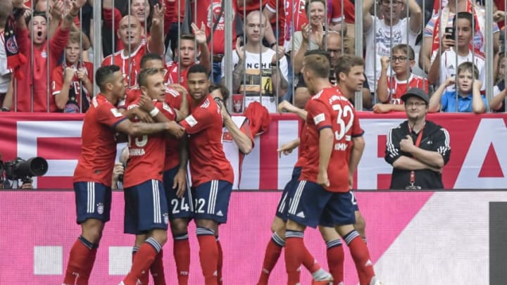 Bayern Munich's French midfielder Corentin Tolisso celebrates his first goal with his team mates during the German First division Bundesliga football match between FC Bayern Munich and Bayer Leverkusen in Munich, on September 15, 2018. (Photo by Guenter SCHIFFMANN / AFP) / DFL REGULATIONS PROHIBIT ANY USE OF PHOTOGRAPHS AS IMAGE SEQUENCES AND/OR QUASI-VIDEO (Photo credit should read GUENTER SCHIFFMANN/AFP/Getty Images)