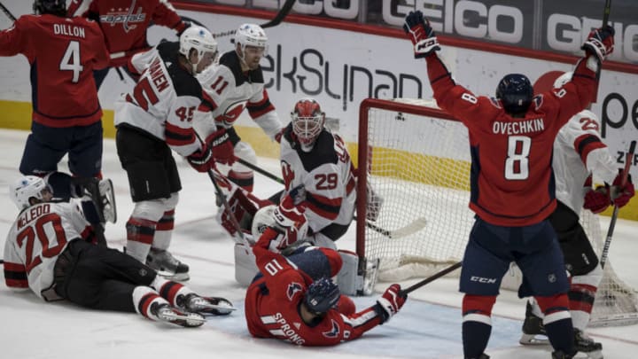 Mar 25, 2021; Washington, District of Columbia, USA; Washington Capitals left wing Alex Ovechkin (8) celebrates after Washington Capitals center Evgeny Kuznetsov (92) not pictured scores a goal against New Jersey Devils goaltender Mackenzie Blackwood (29) during the second period at Capital One Arena. Mandatory Credit: Scott Taetsch-USA TODAY Sports