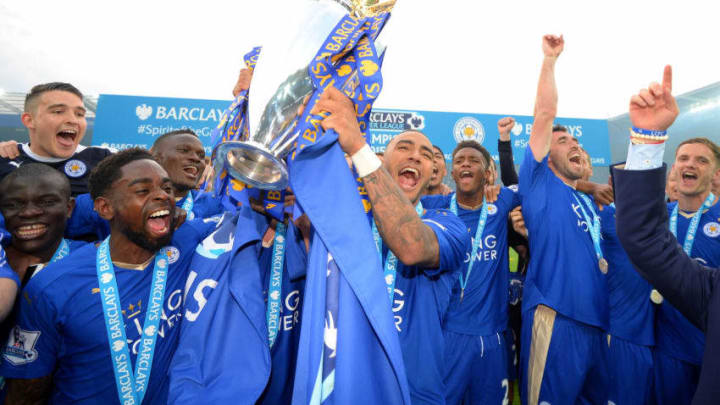 LEICESTER, ENGLAND – MAY 07: Danny Simpson of Leicester City lifts the Premier League Trophy as players celebrate the season champions after the Barclays Premier League match between Leicester City and Everton at The King Power Stadium on May 7, 2016 in Leicester, United Kingdom. (Photo by Michael Regan/Getty Images)