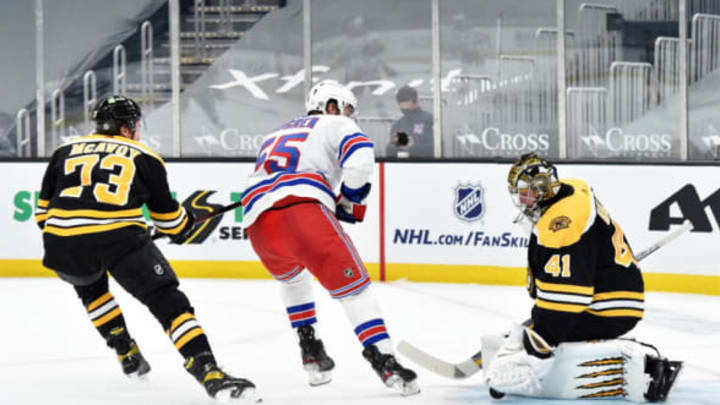 Mar 11, 2021; Boston, Massachusetts, USA; Boston Bruins goaltender Jaroslav Halak (41) makes a save on New York Rangers defenseman Ryan Lindgren (55) while defenseman Charlie McAvoy (73) during the second period at TD Garden. Mandatory Credit: Bob DeChiara-USA TODAY Sports