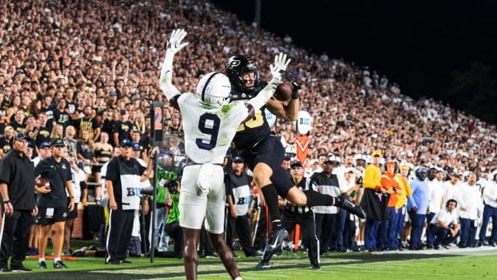 Sep 1, 2022; West Lafayette, Indiana, USA; Purdue Boilermakers wide receiver Charlie Jones (15) attempts to catch the ball while Penn State Nittany Lions cornerback Joey Porter Jr. (9) defends in the second half at Ross-Ade Stadium. Mandatory Credit: Trevor Ruszkowski-USA TODAY Sports