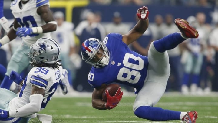 Sep 11, 2016; Arlington, TX, USA; New York Giants wide receiver Victor Cruz (80) is tackled by Dallas Cowboys cornerback Brandon Carr (39) after making a catch in the second quarter at AT&T Stadium. Mandatory Credit: Tim Heitman-USA TODAY Sports