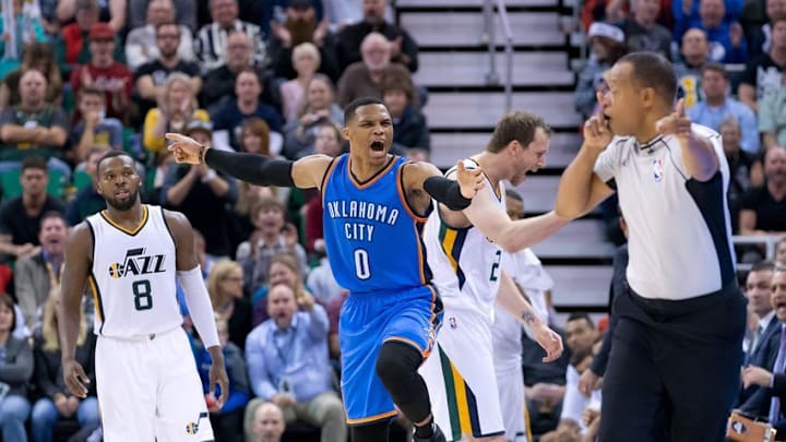 Dec 14, 2016; Salt Lake City, UT, USA; Oklahoma City Thunder guard Russell Westbrook (0) reacts as Utah Jazz guard Shelvin Mack (8) looks on during the second half at Vivint Smart Home Arena. The Jazz won 109-89. Mandatory Credit: Russ Isabella-USA TODAY Sports