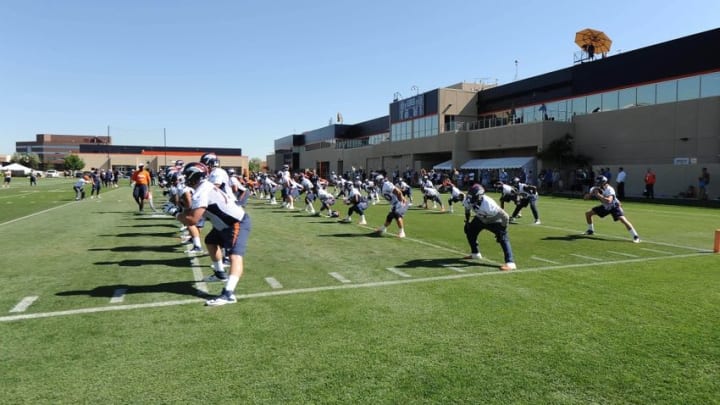 Jul 31, 2015; Englewood, CO, USA; General view as the Denver Broncos warm up before training camp activities at the UCHealth Training Center. Mandatory Credit: Ron Chenoy-USA TODAY Sports