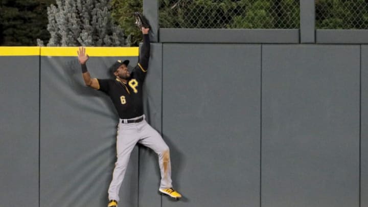 DENVER, CO - AUGUST 29: Starling Marte #6 of the Pittsburgh Pirates catches a fly ball off the bat of Nolan Arenado of the Colorado Rockies to end the fifth inning at Coors Field on August 29, 2019 in Denver, Colorado. (Photo by Joe Mahoney/Getty Images)