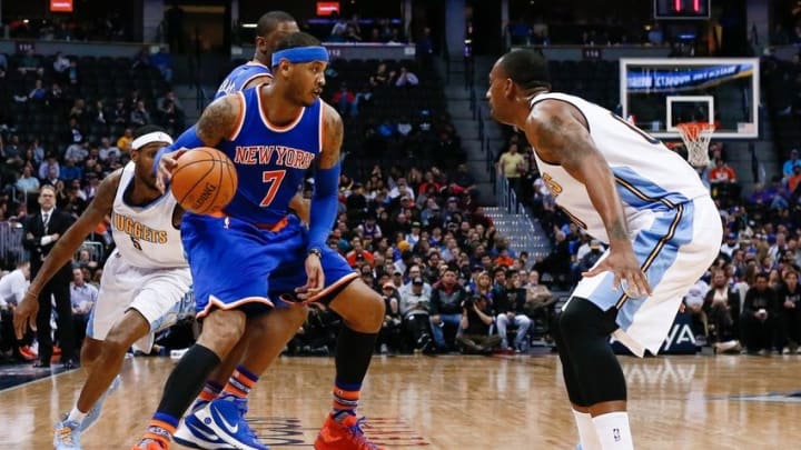 Mar 8, 2016; Denver, CO, USA; New York Knicks forward Carmelo Anthony (7) dribbles the ball against Denver Nuggets forward Darrell Arthur (00) in the third quarter at the Pepsi Center. The Nuggets defeated the Knicks 110-94. Mandatory Credit: Isaiah J. Downing-USA TODAY Sports