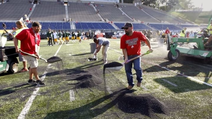 Aug 7, 2016; Canton, OH, USA; Field workers remove rubber pellets from the field before the NFL preseason game between the Green Bay Packers and Indianapolis Colts at Tom Benson Hall of Fame Stadium Mandatory Credit: Rick Wood/Milwaukee Journal Sentinel via USA TODAY Network