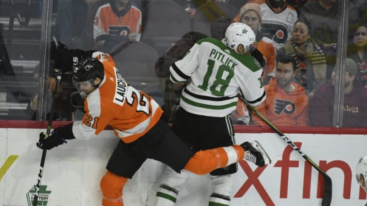 PHILADELPHIA, PA - JANUARY 10: Philadelphia Flyers Left Wing Scott Laughton (21) body checks Dallas Stars Right Wing Tyler Pitlick (18) during the game between the Dallas Stars and the Philadelphia Flyers on January 10, 2019 at Wells Fargo Center in Philadelphia,PA. (Photo by Andy Lewis/Icon Sportswire via Getty Images)