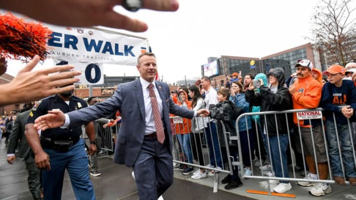 Auburn football head coach Bryan Harsin greets fans at the Tiger Walk as the team arrives for the Birmingham Bowl at Protective Stadium in Birmingham, Ala., on Tuesday December 28, 2021.Pre02