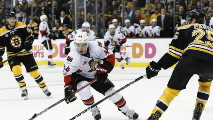 BOSTON, MA - APRIL 06: Ottawa Senators center Jean-Gabriel Pageau (44) tries to get past Boston Bruins right defenseman Brandon Carlo (25) during a regular season NHL game between the Boston Bruins and the Ottawa Senators on April 6, 2017, at TD Garden in Boston, Massachusetts. The Senators defeated the Bruins 2-1 (SO). (Photo by Fred Kfoury III/Icon Sportswire via Getty Images)