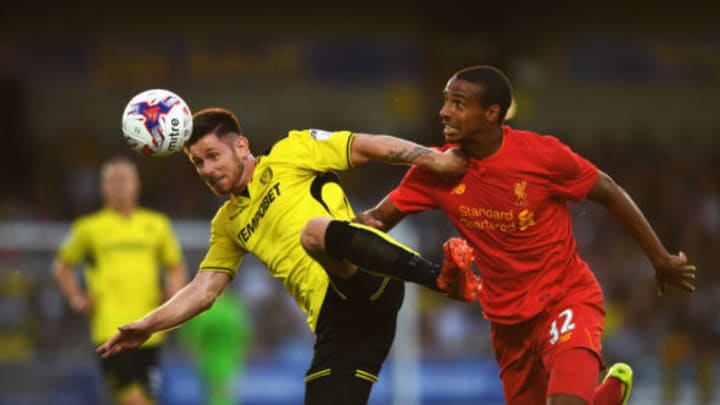 BURTON UPON TRENT, ENGLAND - AUGUST 23: Calum Butcher of Burton Albion is challenged by Joel Matip of Liverpool during the EFL Cup second round match between Burton Albion and Liverpool at Pirelli Stadium on August 23, 2016 in Burton upon Trent, England. (Photo by Gareth Copley/Getty Images)