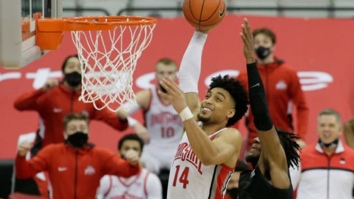 Ohio State Buckeyes forward Justice Sueing (14) goes up for a shot while guarded by Michigan State Spartans forward Aaron Henry (0) during Sunday's NCAA Division I men's basketball game at Value City Arena in Columbus, Ohio on January 31, 2021. Ohio State won the game 79-62.Ceb Osu Mbk Msu Bjp 2168