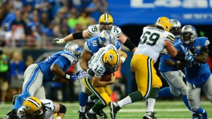 Sep 21, 2014; Detroit, MI, USA; Detroit Lions defensive tackle Ndamukong Suh (90) sacks Green Bay Packers quarterback Aaron Rodgers (12) during the second quarter at Ford Field. Mandatory Credit: Andrew Weber-USA TODAY Sports