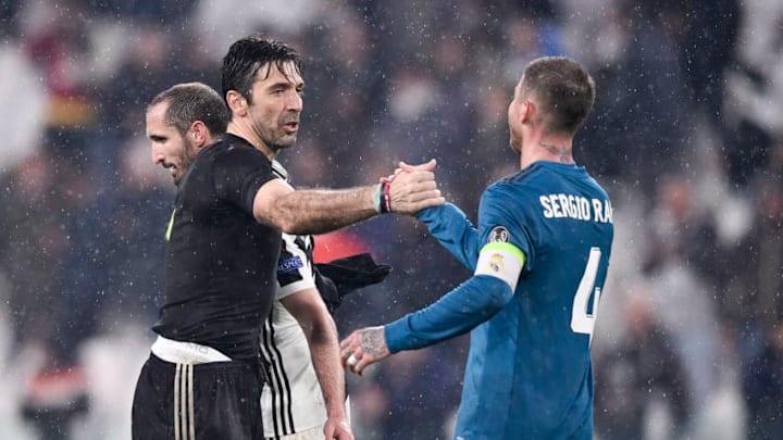 TURIN, ITALY - APRIL 03: Gianluigi Buffon of Juventus and Sergio Ramos of Real Madrid in action during the UEFA Champions League Quarter Final Leg One match between Juventus and Real Madrid at Allianz Stadium on April 3, 2018 in Turin, Italy. (Photo by Daniele Badolato - Juventus FC/Juventus FC via Getty Images)