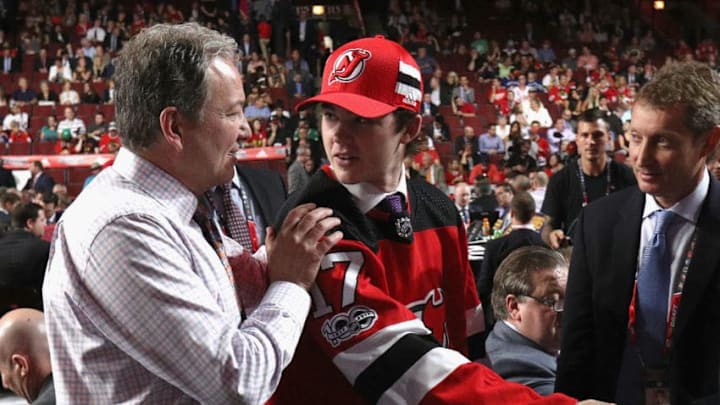CHICAGO, IL - JUNE 24: Reilly Walsh meets general manager Ray Shero after being selected 81st overall by the New Jersey Devils during the 2017 NHL Draft at United Center on June 24, 2017 in Chicago, Illinois. (Photo by Dave Sandford/NHLI via Getty Images)
