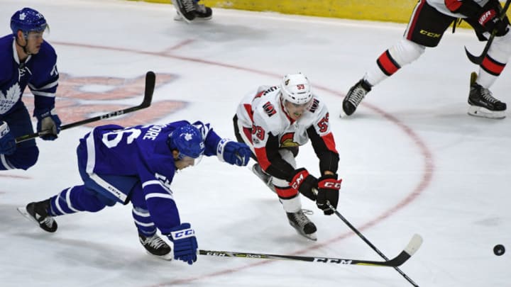 TORONTO, ON - SEPTEMBER 10: Ottawa Senators Forward Alex Formenton (59) and Toronto Maple Leafs Forward Trevor Moore (56) fight for the puck during the NHL preseason Rookie Tournament game between the Ottawa Senator and Toronto Maple Leafs on September 10, 2017 at Ricoh Coliseum in Toronto, ON.(Photo by Gerry Angus/Icon Sportswire via Getty Images)