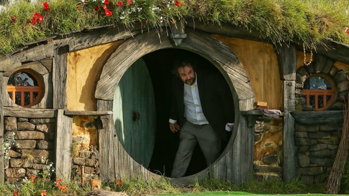 WELLINGTON, NEW ZEALAND – NOVEMBER 28: Director Sir Peter Jackson emerges from from a Hobbit house before delivering a speech at the ‘The Hobbit: An Unexpected Journey’ World Premiere at Embassy Theatre on November 28, 2012 in Wellington, New Zealand. (Photo by Hagen Hopkins/Getty Images)
