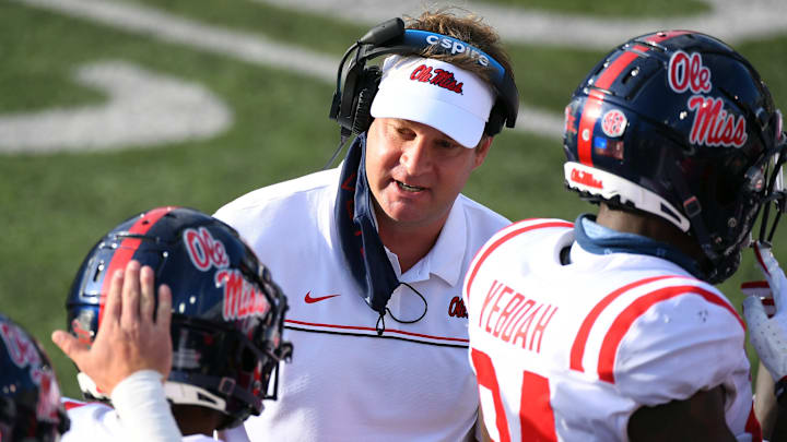 Oct 31, 2020; Nashville, Tennessee, USA; Mississippi Rebels head coach Lane Kiffin congratulates Mississippi Rebels wide receiver Elijah Moore (8) after a touchdown during the first half against the Vanderbilt Commodores at Vanderbilt Stadium. Mandatory Credit: Christopher Hanewinckel-USA TODAY Sports