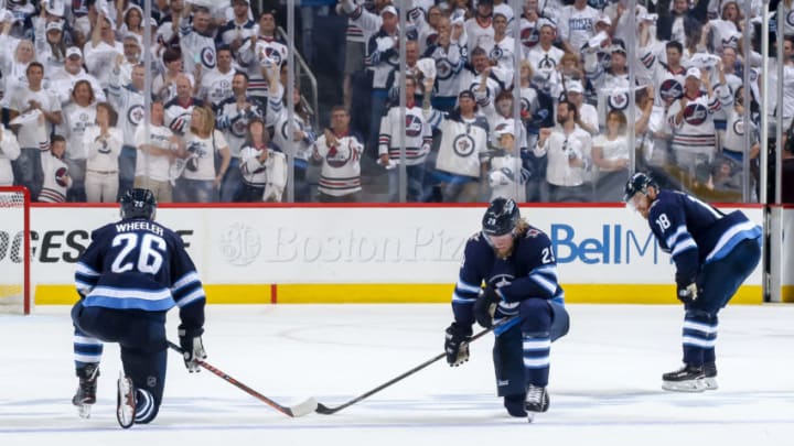 WINNIPEG, MB - MAY 20: Blake Wheeler #26, Patrik Laine #29 and Bryan Little #18 of the Winnipeg Jets react following the final buzzer in a 2-1 loss against the Vegas Golden Knights in Game Five of the Western Conference Final during the 2018 NHL Stanley Cup Playoffs at the Bell MTS Place on May 20, 2018 in Winnipeg, Manitoba, Canada. The Knights win the series 4-1. (Photo by Jonathan Kozub/NHLI via Getty Images)