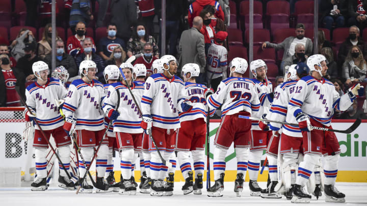 The New York Rangers celebrate their victory against the Montreal Canadiens (Photo by Minas Panagiotakis/Getty Images)