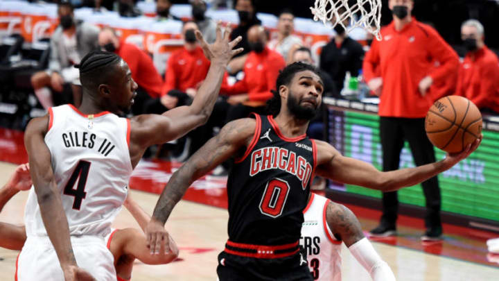 Jan 5, 2021; Portland, Oregon, USA; Chicago Bulls guard Coby White (0) drives to the basket against Portland Trail Blazers forward Harry Giles III (4) during the second half at Moda Center. Mandatory Credit: Steve Dykes-USA TODAY Sports