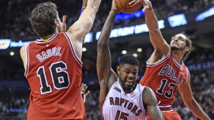 Chicago Bulls forward Pau Gasol (16) and center Joakim Noah (13) block Toronto Raptors forward Amir Johnson (15) during the third quarter at Air Canada Centre. Chicago won 100 - 93. Mandatory Credit: Peter Llewellyn-USA TODAY Sports
