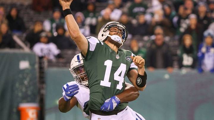 Dec 5, 2016; East Rutherford, NJ, USA; New York Jets quarterback Ryan Fitzpatrick (14) is hit by Indianapolis Colts defensive tackle Hassan Ridgeway (91) as he throws a pass during the first half at MetLife Stadium. Mandatory Credit: Ed Mulholland-USA TODAY Sports