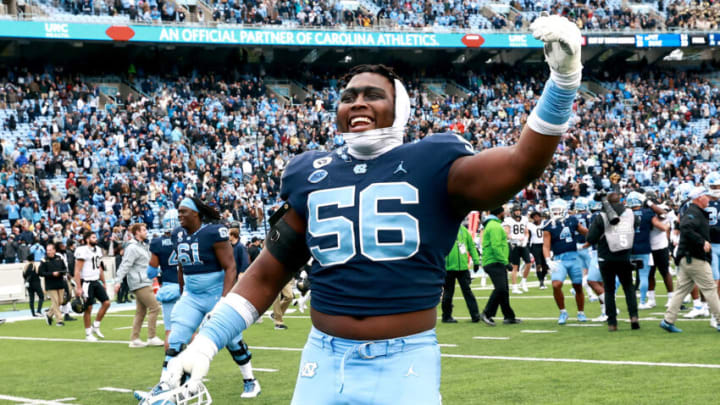 CHAPEL HILL, NORTH CAROLINA - NOVEMBER 06: Tomari Fox #56 of the North Carolina Tar Heels reacts after a win against the Wake Forest Demon Deacons during their game at Kenan Memorial Stadium on November 06, 2021 in Chapel Hill, North Carolina. The Tar Heels won 58-55. (Photo by Grant Halverson/Getty Images)