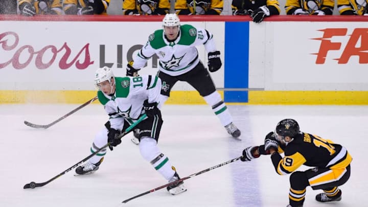 PITTSBURGH, PA - MARCH 11: Dallas Stars Right Wing Tyler Pitlick (18) skates with the puck while Pittsburgh Penguins Center Derick Brassard (19) defends during the first period in the NHL game between the Pittsburgh Penguins and the Dallas Stars on March 11, 2018, at PPG Paints Arena in Pittsburgh, PA. (Photo by Jeanine Leech/Icon Sportswire via Getty Images)