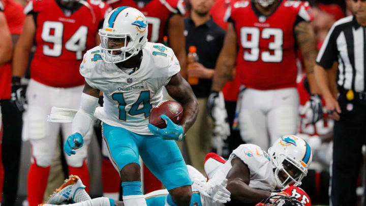 ATLANTA, GA - OCTOBER 15: Jarvis Landry #14 of the Miami Dolphins attempts to break a tackle by Brian Poole #34 of the Atlanta Falcons at Mercedes-Benz Stadium on October 15, 2017 in Atlanta, Georgia. (Photo by Kevin C. Cox/Getty Images)