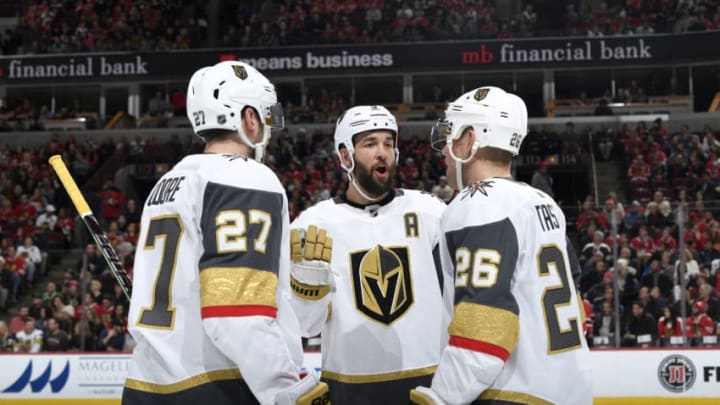 CHICAGO, IL - JANUARY 12: Deryk Engelland #5 of the Vegas Golden Knights talks with teammates Shea Theodore #27 and Paul Stastny #26 in the first period against the Chicago Blackhawks at the United Center on January 12, 2019 in Chicago, Illinois. (Photo by Bill Smith/NHLI via Getty Images)